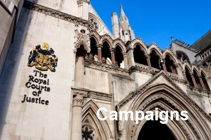 The outside of the Royal Courts of Justice main entrance. A stone building with a blue back ground with the word Campaigns labled. Links to our Campaigns page